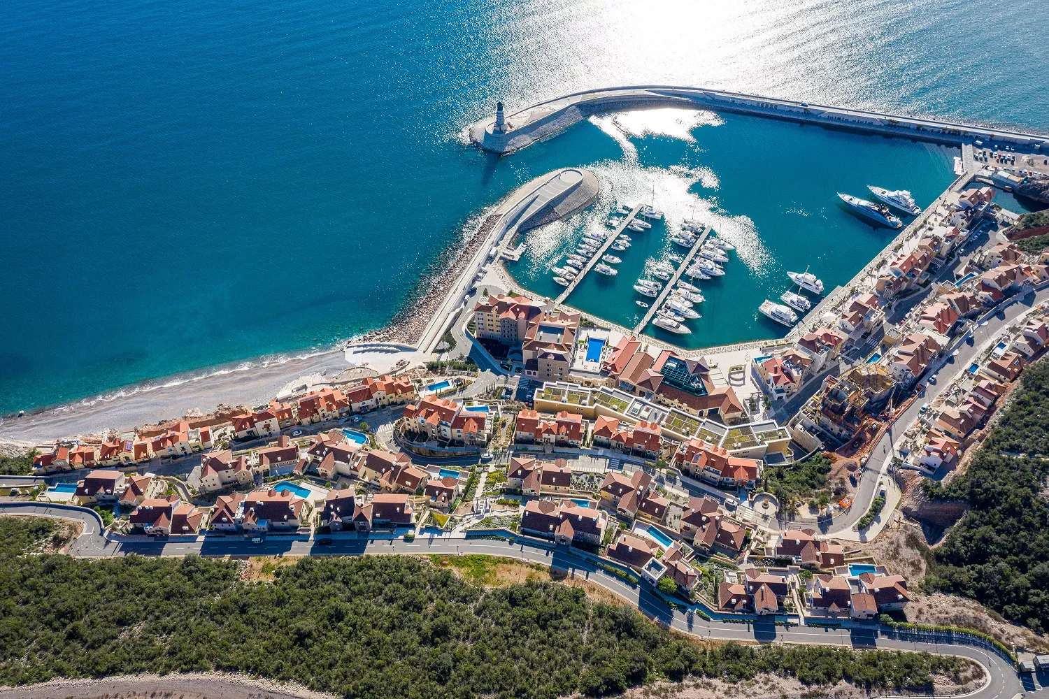 Lustica bay marina village areal photo hero